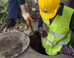 Carylon employee in a manhole